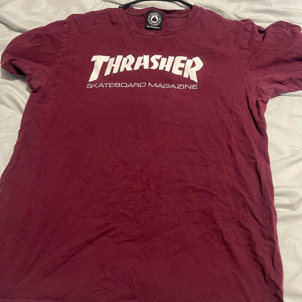 Red thrashers shirt. Size medium. But will Most likely fits size large. Unisex.